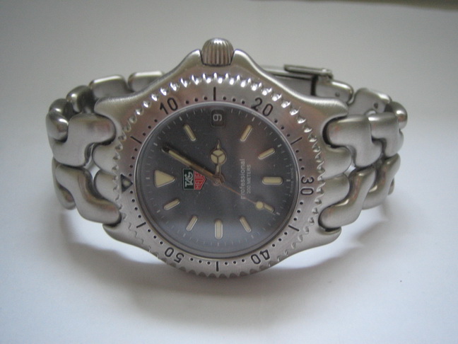 ขายนาฟิกาข้อมือ Tag Heuer ก้างปลา Boy Size สายด้านล้วน มือสอง ของแท้ รูปที่ 1
