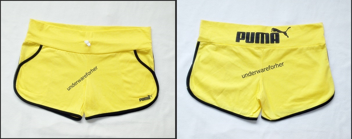กางเกงขาสั้น PUMA สีเหลืองตัดขอบสีดำ รูปที่ 1