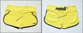 กางเกงขาสั้น PUMA สีเหลืองตัดขอบสีดำ